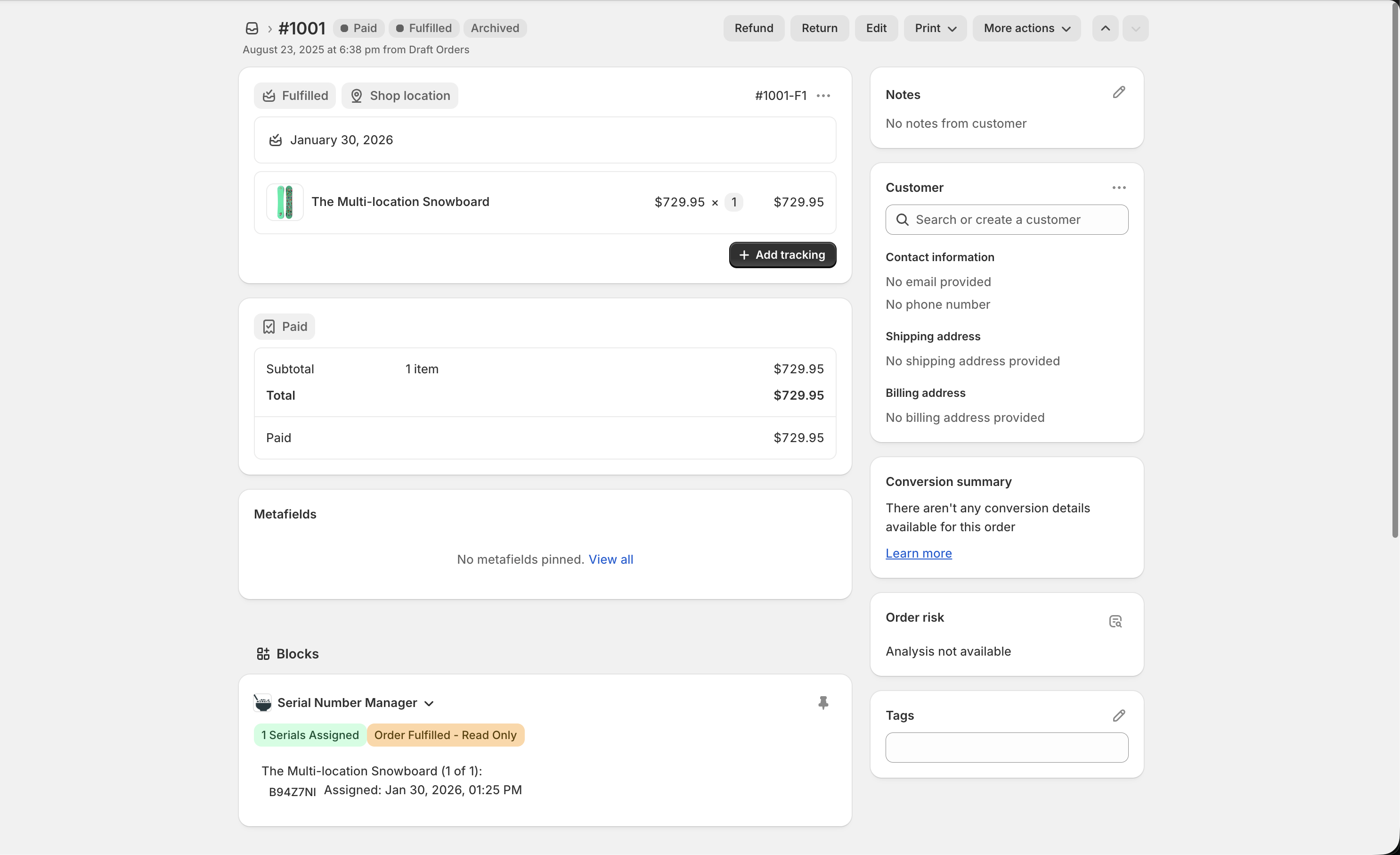 Fulfilled Shopify order showing Serial Number Manager block with assigned serial number and timestamp
